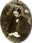 Photograph of Lewis Carroll reading